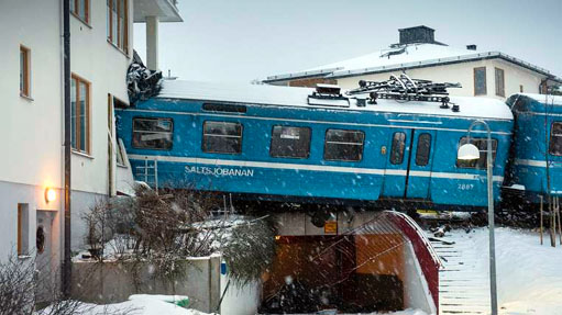 Local train that derailed and crashed into a residential building in Saltsjobaden is seen outside Stockholm